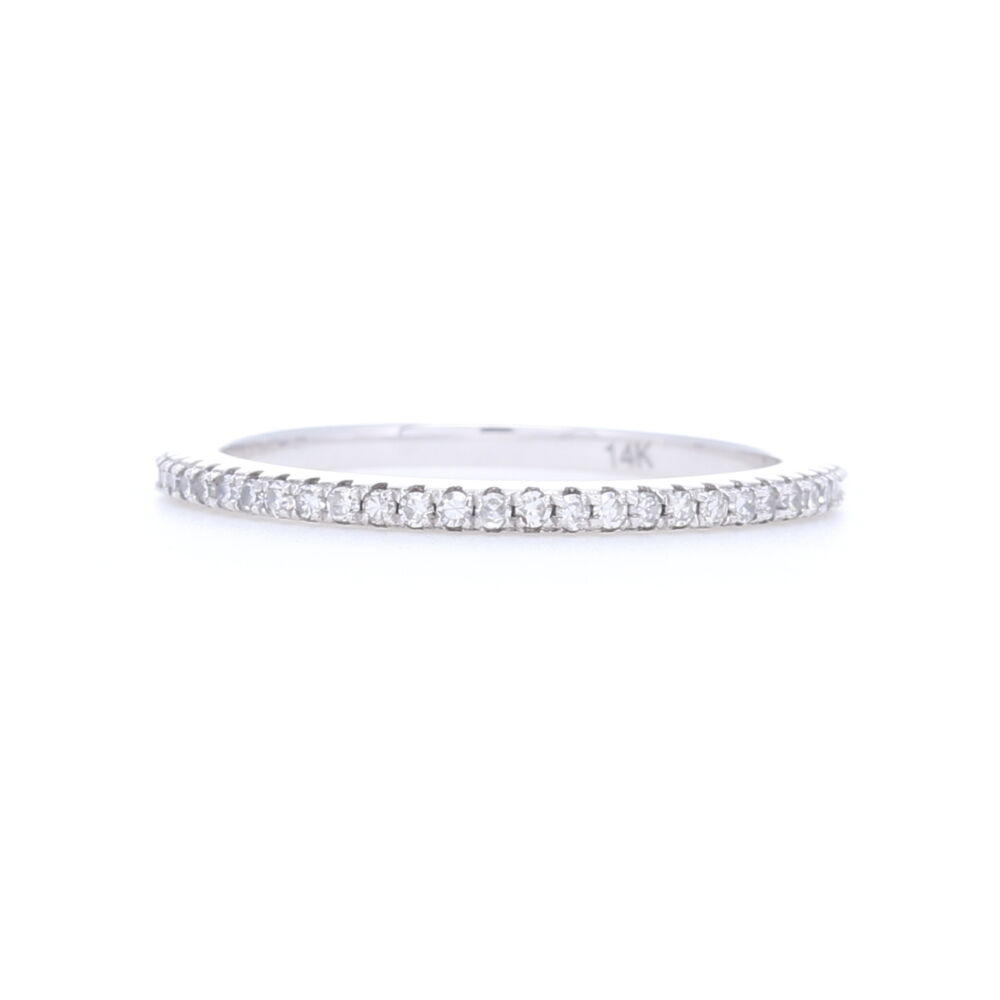 Need a simple stack ring to add a bit of sparkle but not overtake your finger so you have enough room for more. This brilliant cut diamond eternity band is perfect. Approximately .4 carats of diamonds and set in strong 14k white gold as to not have to worry about losing diamonds. This will be one of your favorite rings to wear with your stacks. 14k White Gold, White Brilliant Cut Diamond Eternity Petite Stack Ring Band
