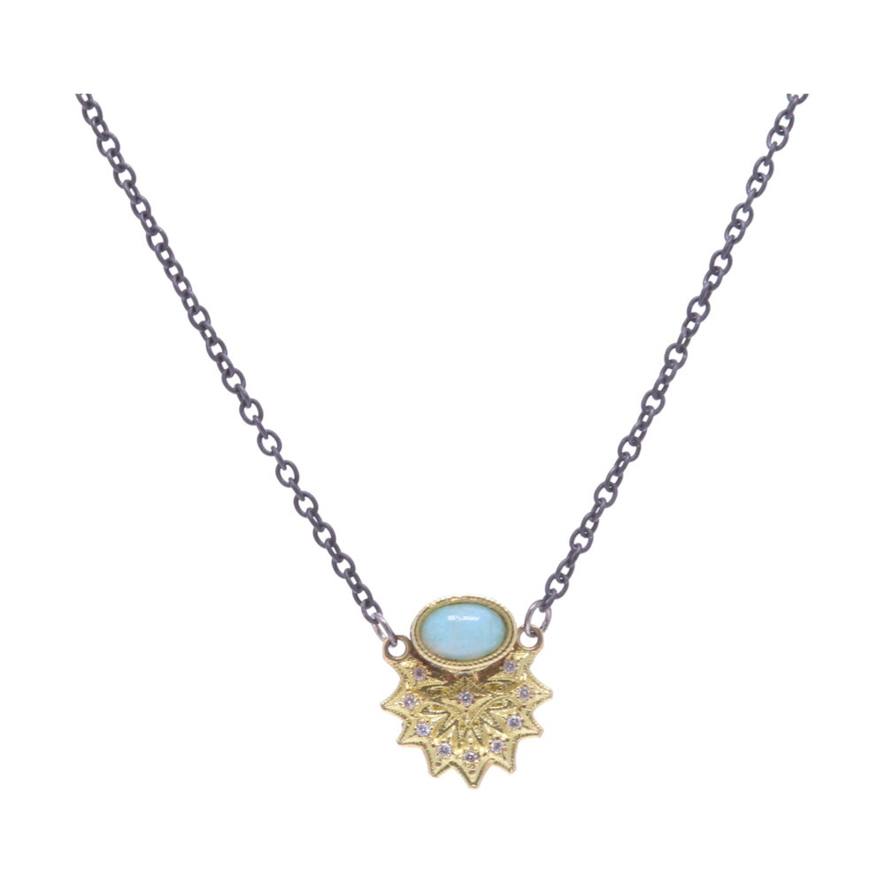 This necklace from the Old World Collection by Armenta features a aquaprase chalcedony stone. Dropping from the stone is an 18k yellow gold leaf-like connected charm accented with white diamonds. Aquaprase Chalcedony Necklace