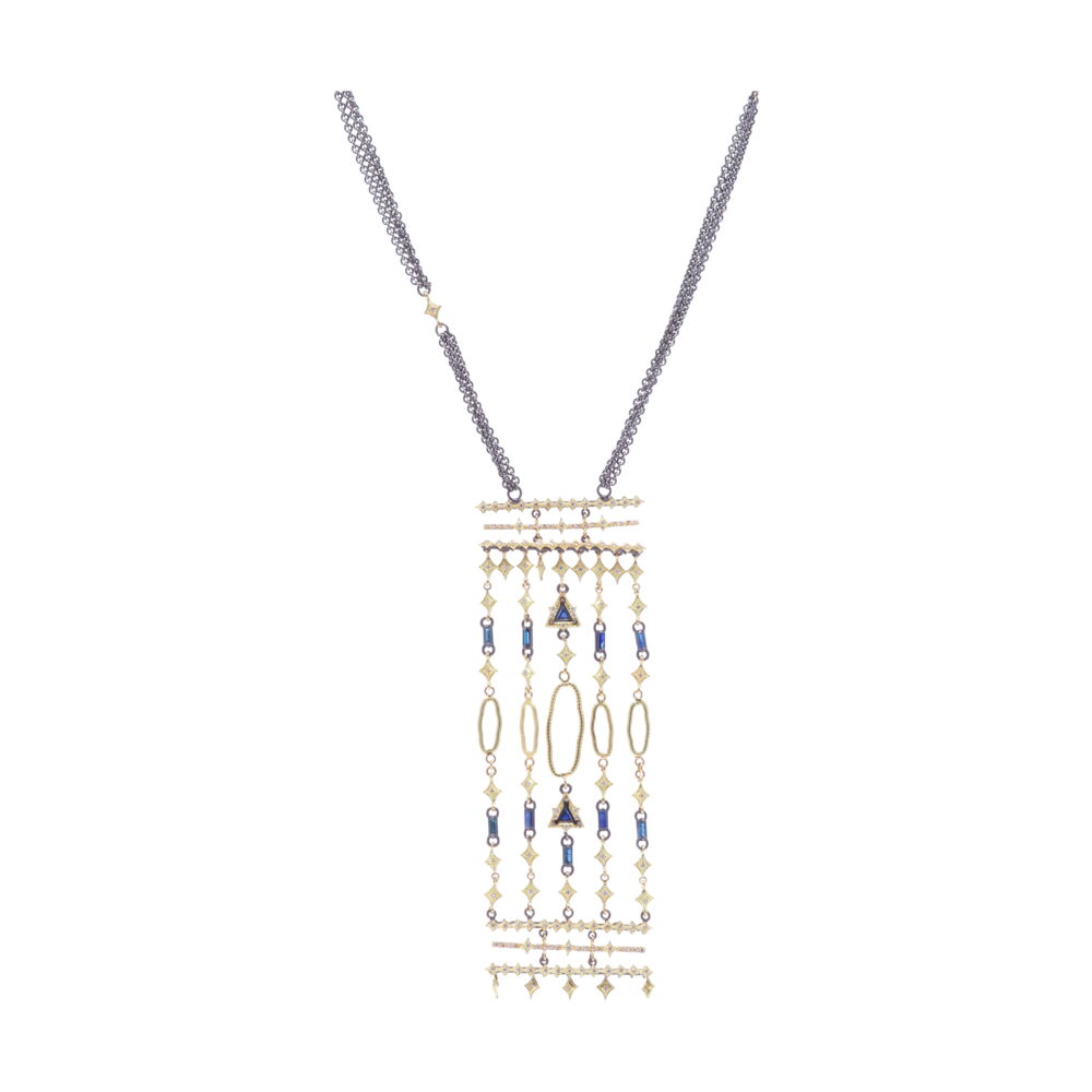 The necklace from Armenta's Old World Collection, features blackened sterling silver and 18k yellow gold. This bar necklace features a chandelier, displaying trillion and baguette blue sapphires. Bar Chandelier Necklace