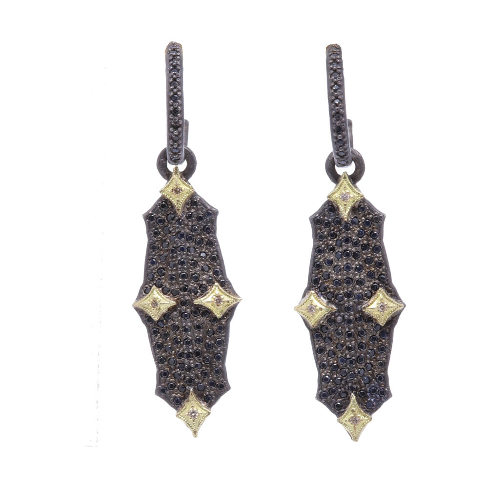 These Old World Collection Earrings from Armenta are featured in an oxidized sterling silver. Displaying a hoop with a dangling charm: charm exhibits 18k yellow gold hinge like accents with black diamonds set throughout the whole charm, as well as set into the hoop. Hoop Drop Earrings