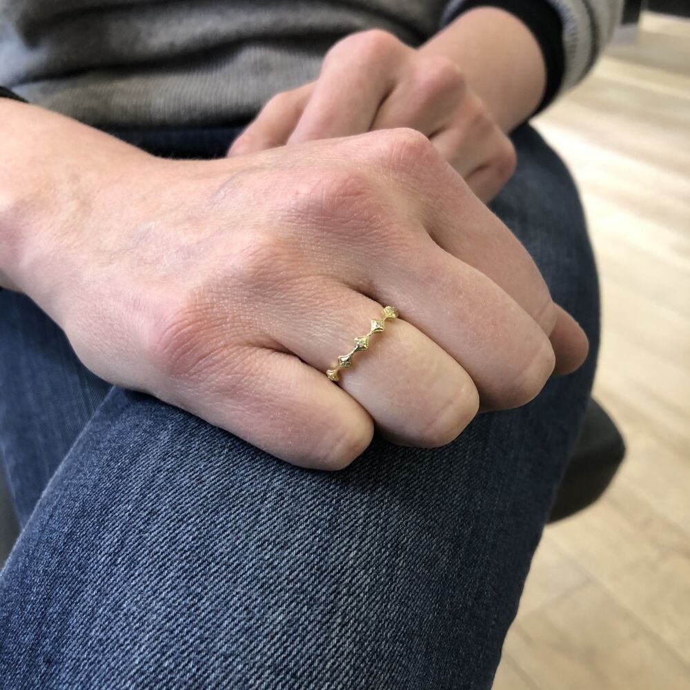 <div>This matte 18k yellow gold stacker ring features 12 petite crivelli's with white diamond stations, making up this band. <span style="font-size: 1.2rem;">Add dimension and some glamour to your collection. </span></div> Petite Crivelli Stack Band