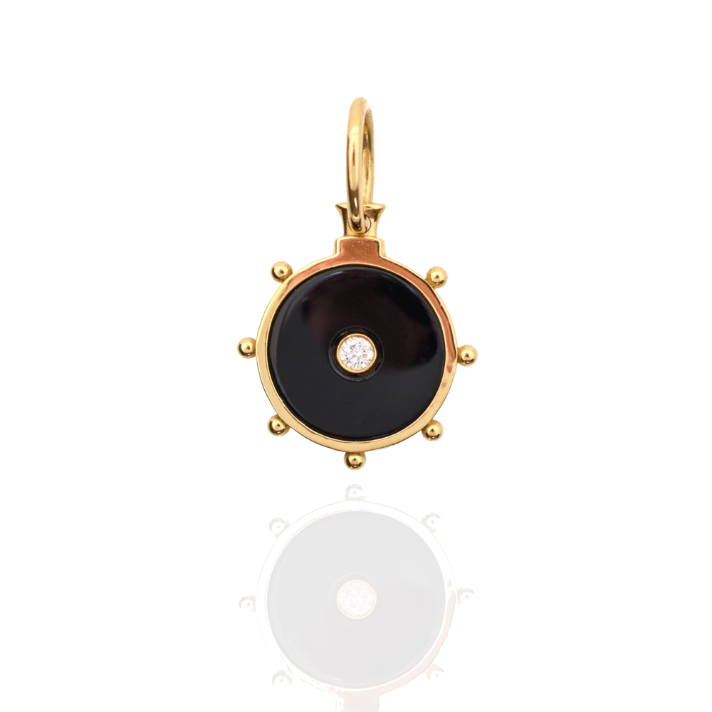 This pendant displays onyx, with a diamond set center. This 18k yellow gold pendant gets its influence from the Etruscan Revival (Victorian Era). Florence Pendant Onyx and diamond 18k