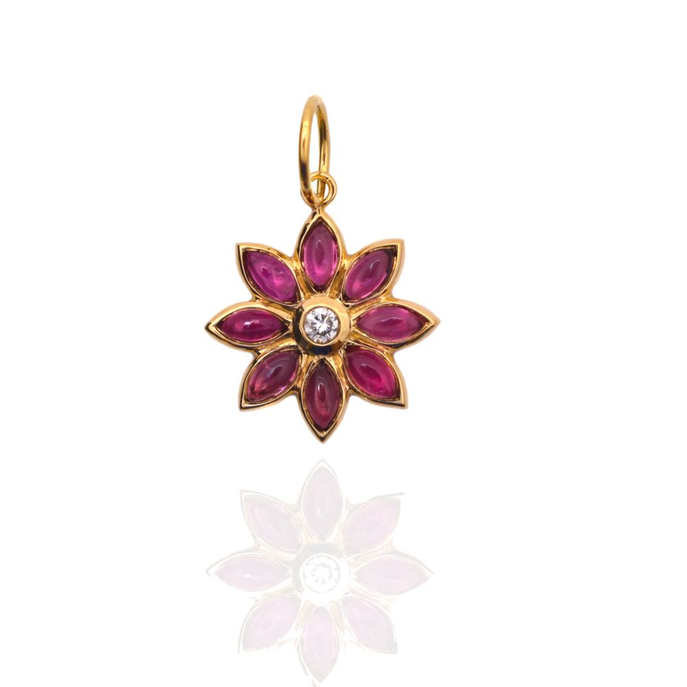 This Dahlia shaped 18k yellow gold pendant features a diamond center with eight pink tourmaline cabochon petals.
Dahlia Pendant