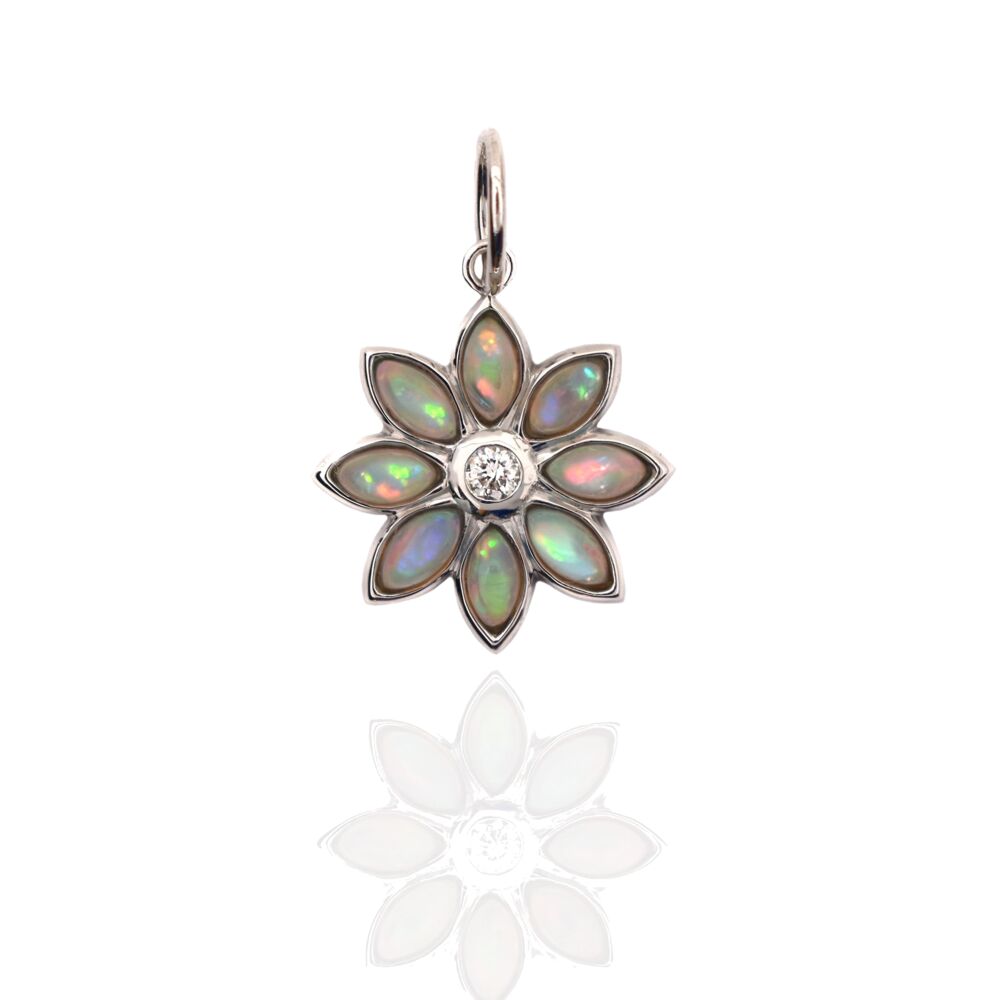 This 18k yellow gold dahlia shaped charm, is set with a center diamond: with opal petals. Dahlia Pendant Opal 18k