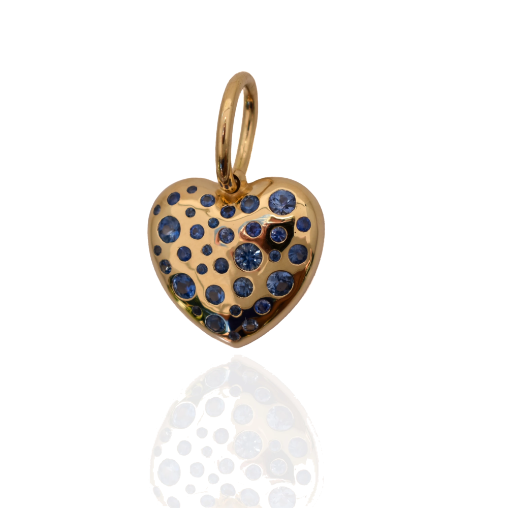 This bulbous 18k yellow gold shaped heart features 34 flush set blue sapphires.
Total weight 1.50ct Love Heart Pendant Blue Sapphires 18k