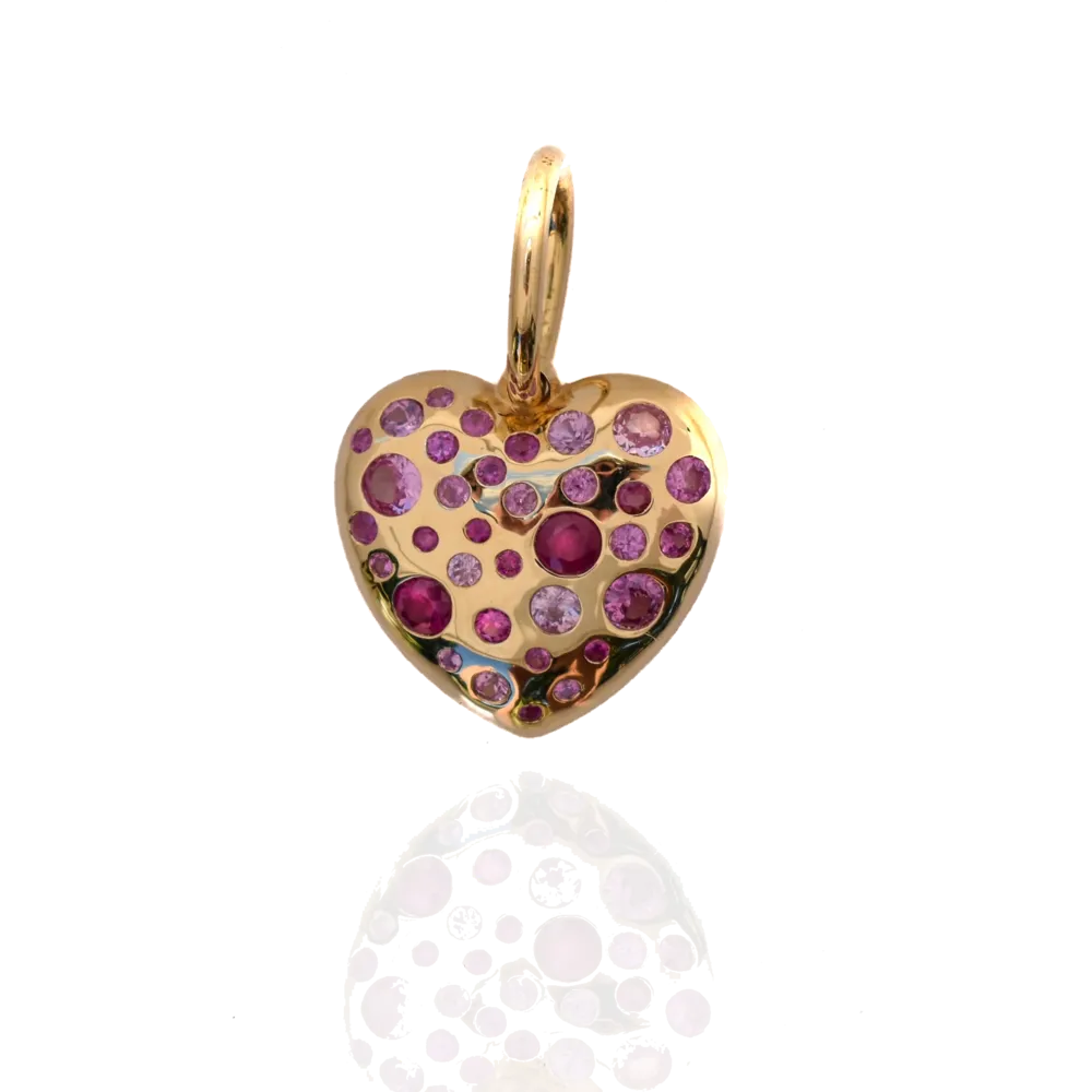 This bulbous 18k yellow gold heart shaped pendant has 34 flush set pink sapphires.
Total weighing 1.50ct.
Love Heart Pendant - Pink Sapphires 18k