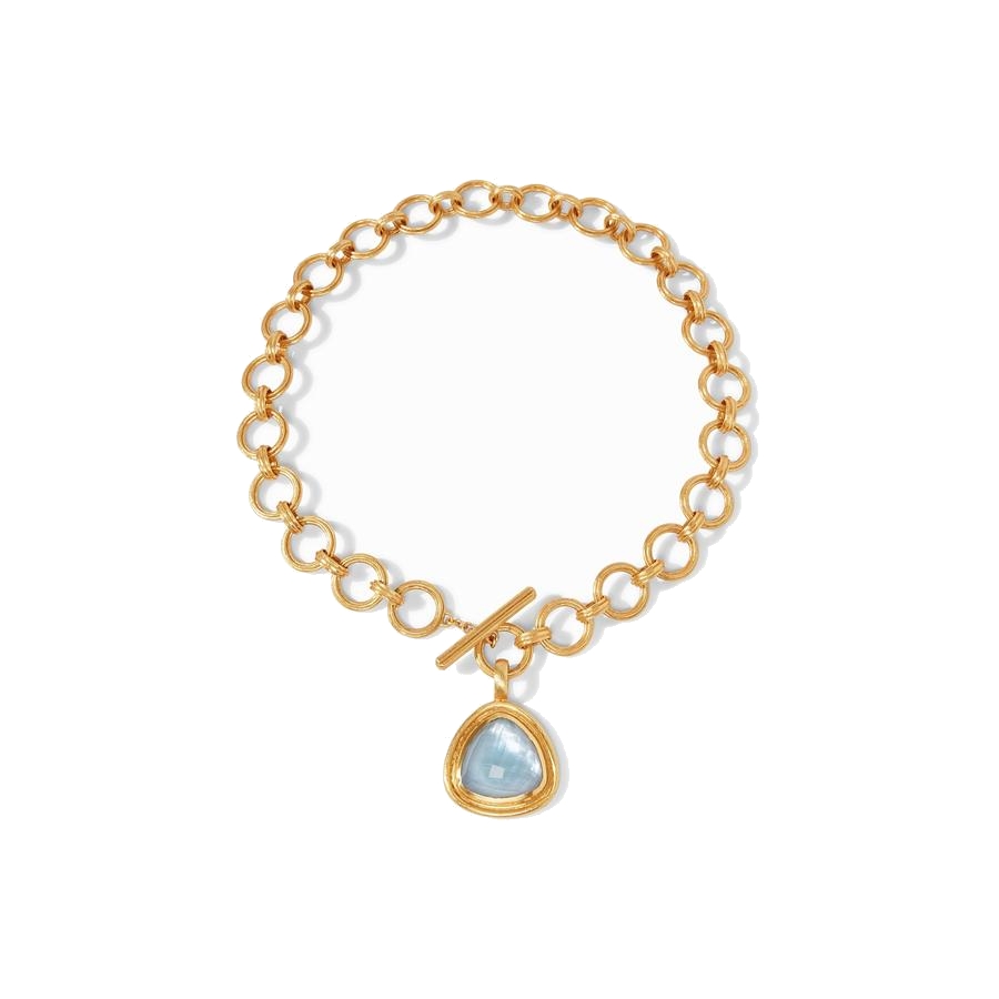 Showcasing a radiant rose cut gemstone of imported glass on elegantly scored golden links, front toggle closure. Barcelona Statement Necklace