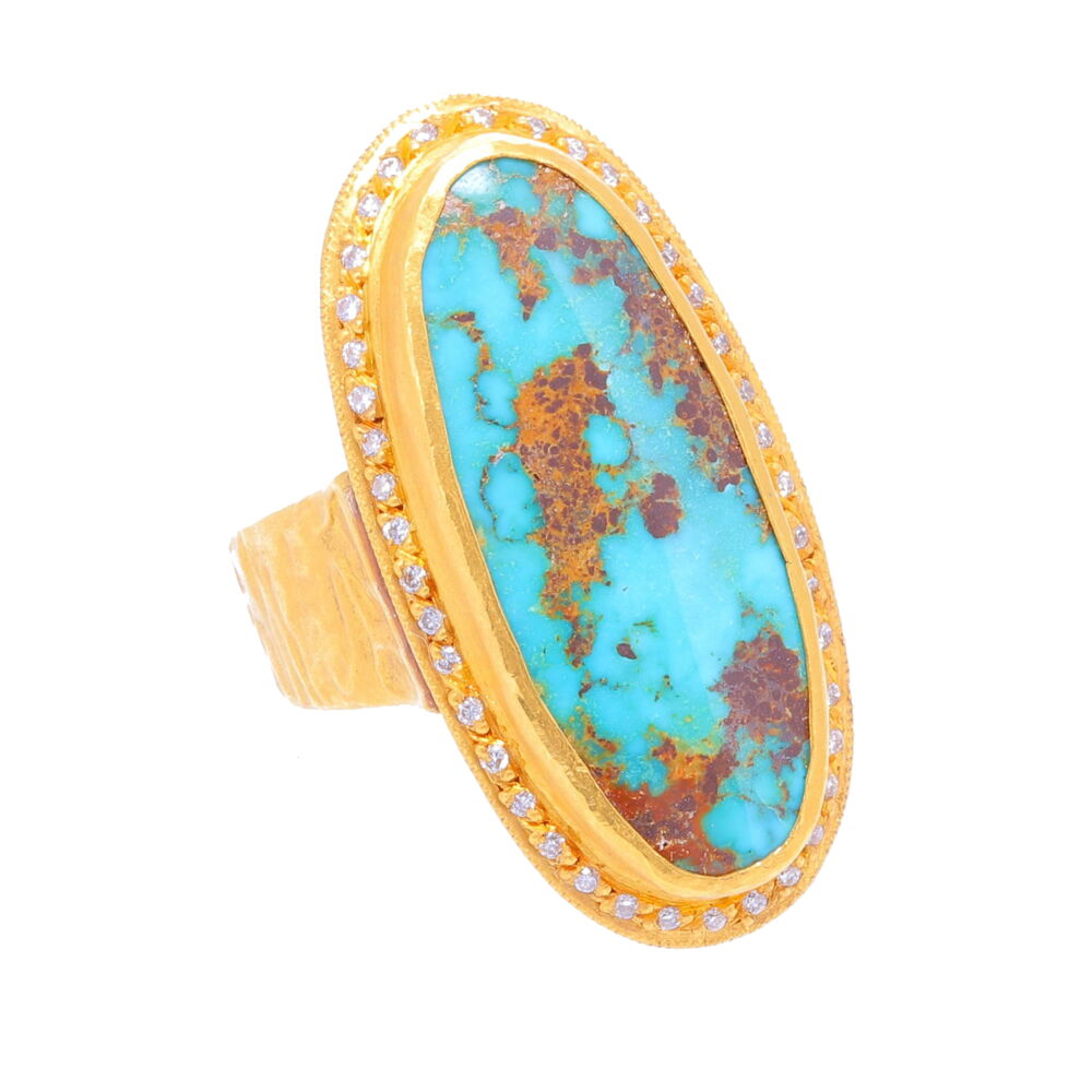 This one of a kind ring, by turkish designer Kurtulan, features a beautiful elongated piece of Turquoise with multi tone rusty red matrix set in a 24k bezel and surrounded by 41 (0.26tcw) sparkling diamonds. Ring fits like a 6.5 but can be sized for extra charge with a 4-6 week wait. Elongated Turquoise and Diamond Ring