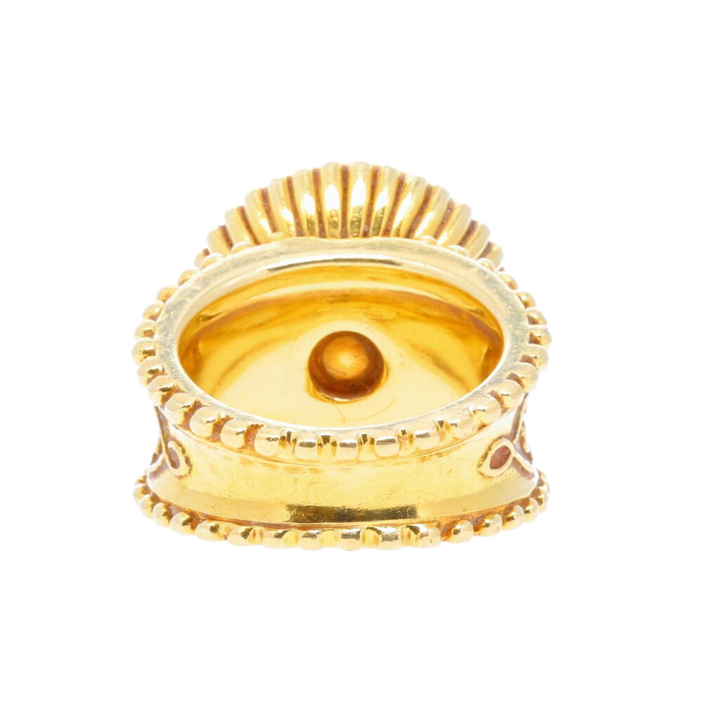 This stunning ring showcases an 18 carat yellow sapphire. Set in 18k yellow gold, this ring is a true statement piece wherever you go. Scroll designs adorn this ring from every angle, with the artisanship of this ring truly one of a kind. Cynthia Bach Oval Scroll Yellow Sapphire Ring