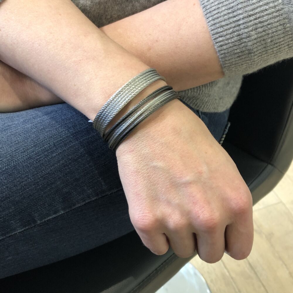 <div>This simply chic grey colored heat treated steel cable comes in an open cuff, designed to fit anyone's wrist. Layer this with more bracelets to create a fun look, or wear alone. </div> Grey Cable Mini Cuff