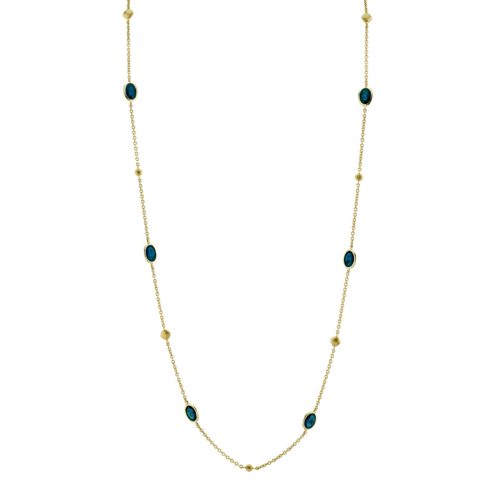 <span style="font-size: 16.8px; position: initial; margin: initial;">SLOANE STREET LONDON BLUE TOPAZ BEADED 40” CHAIN IN 18K YELLOW GOLD FEATURES SPARKLING BEZEL SET WHITE TOPAZ STATIONS SEPARATED BY SHIMMERING GOLD STRIE TEXTURED CUSHIONS WITH LOBSTER CLASP. THIS VERSATILE CHAIN CAN BE WORN LONG OR DOUBLED FOR A LAYERED LOOK. A LUXURIOUS BLUE JEAN COLOR THAT CAN COMPLIMENT ANY OUTFIT.</span> London Blue Topaz By The Yard Chain