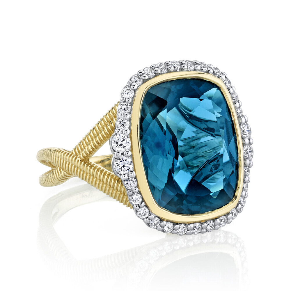 <span style="font-size: 16.8px; position: initial; margin: initial;">LONDON BLUE RING WITH WHITE DIAMOND DETAIL SET IN 18K YELLOW GOLD</span> London Blue Topaz Ring with White Diamond Detail