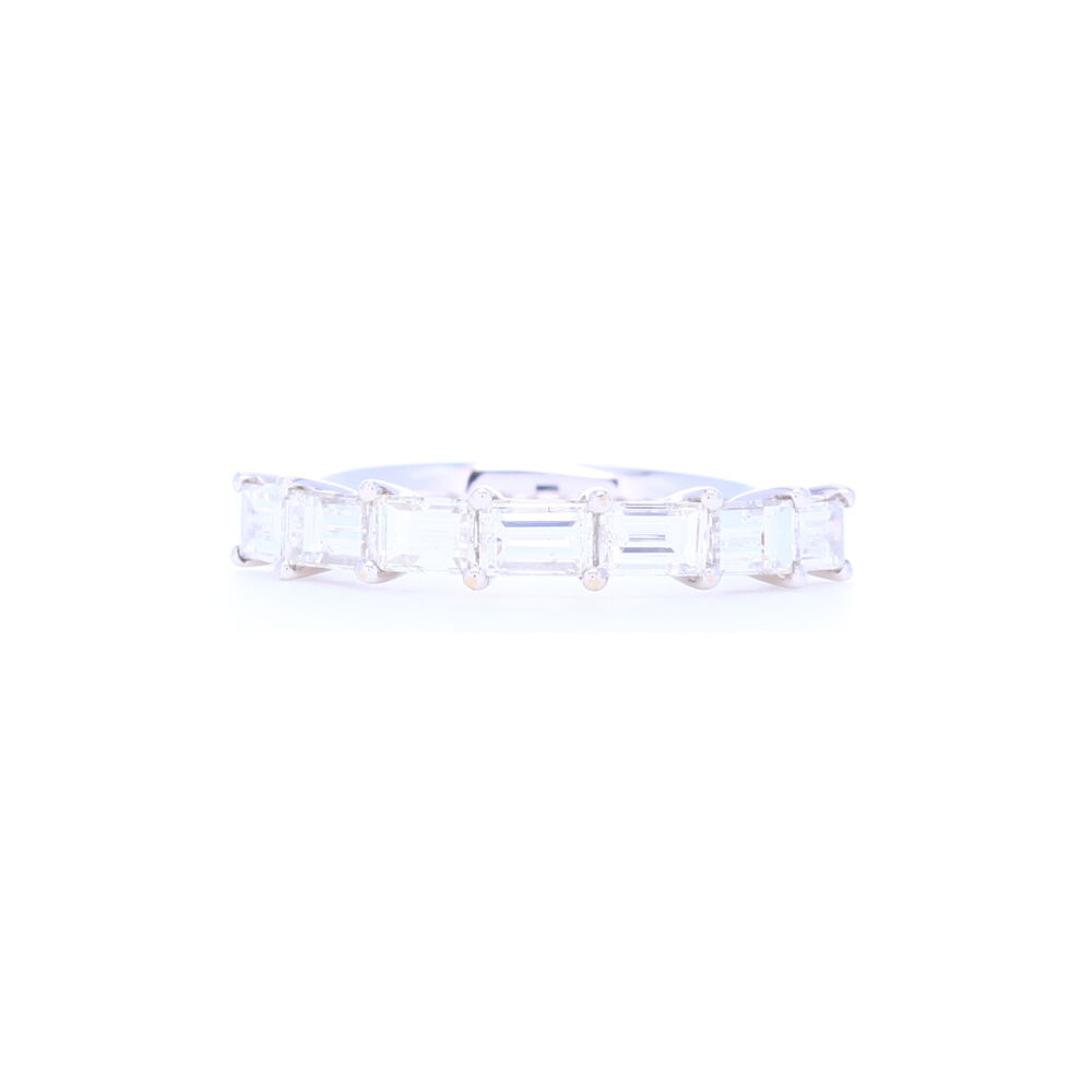 Uniquely set baguette diamonds give this 18k white gold stacking ring a signature sophisticated look. Eye clean diamonds totaling 1.78 carats and sleek shared prong setting make this a classic you'll wear for years. 18k White Gold Side Set Baguette Diamond Stack Ring