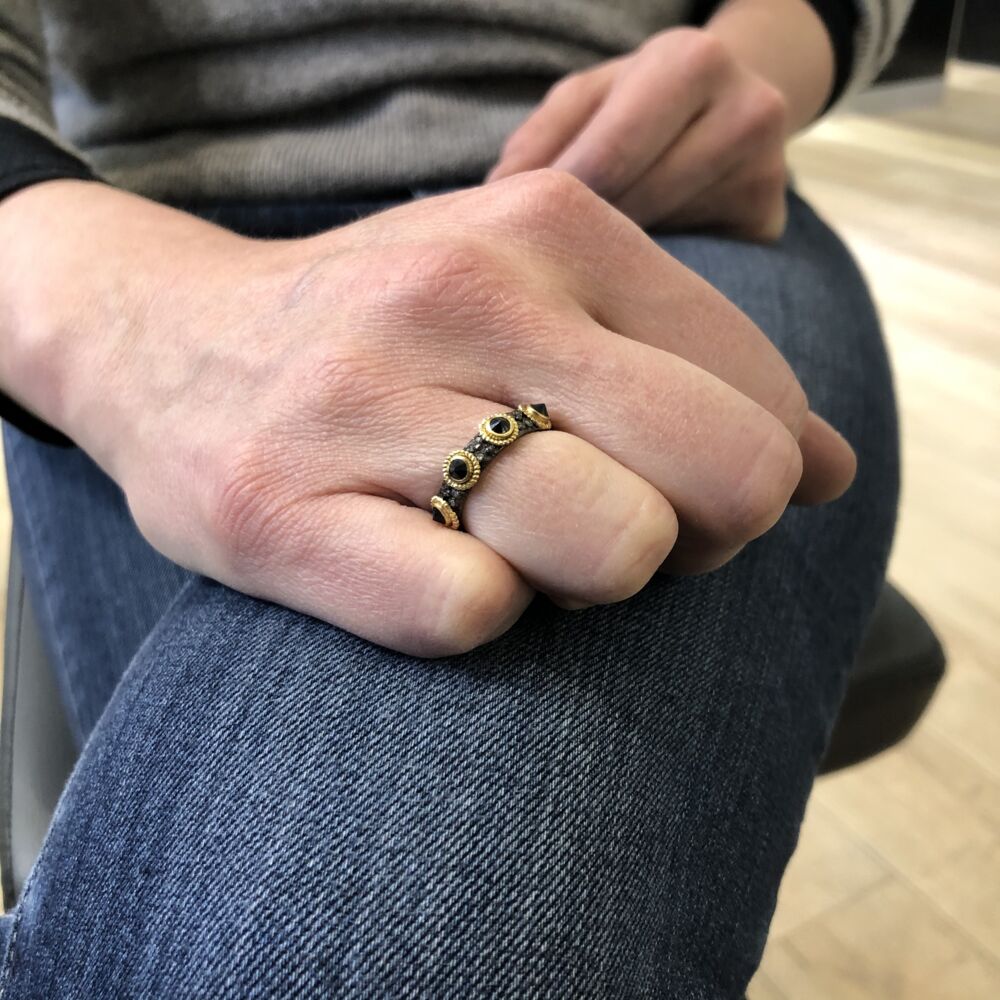<div style="position: initial; margin: initial;">This beautiful 3mm black sapphire eternity ring by Armenta is designed and manufactured by women in Houston, Texas. Made with 18k yellow gold and an oxidized sterling silver for a striking mixed metal look, this ring will play well with others stacked. Also exhibiting four diamond stations in between every black sapphire station, this ring has enough dimension and beauty to hold on its own. <br style="position: initial; margin: initial;"></div> Old World Black Sapphire Sterling Silver Ring