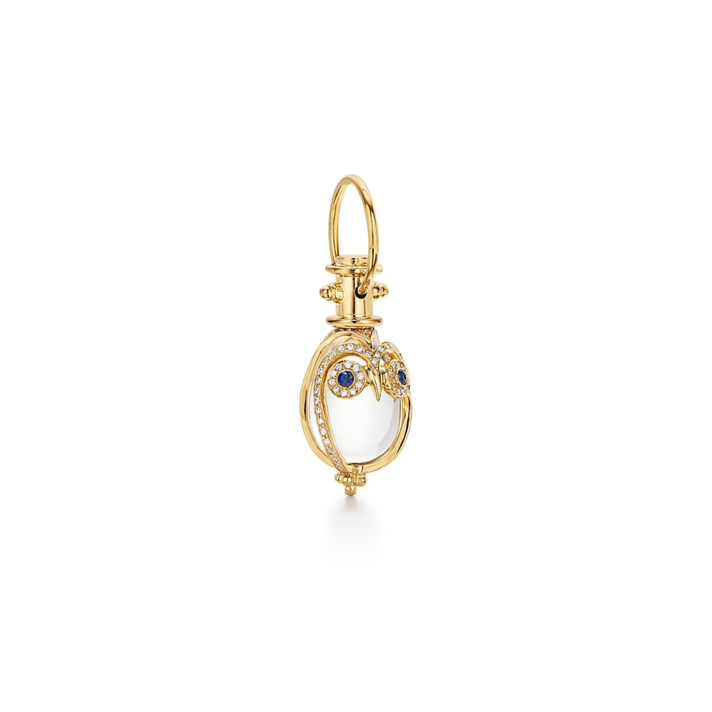 18K Owl Amulet with blue sapphire eyes and pave diamonds. Temple's amulets typically come in four different sizes, most come in three. This owl amulet comes in S, M, L. We have small in stock, and ready to ship. Each size costs differently. Chat with us for more information! Small 18K Owl Amulet with blue sapphire and diamond pave