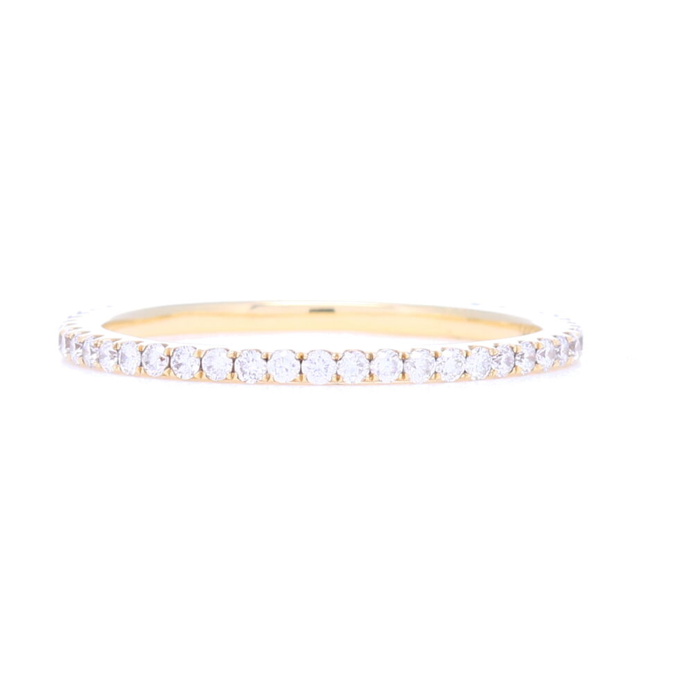 This 18k yellow gold micro pave diamond band ring is classy, sophisticated and timeless. The versatility of this size 9 ring allows it to either be worn stacked with other rings or alone, and suitable for any occasion. 18k Yellow Gold Micro Pave Diamond Band Ring