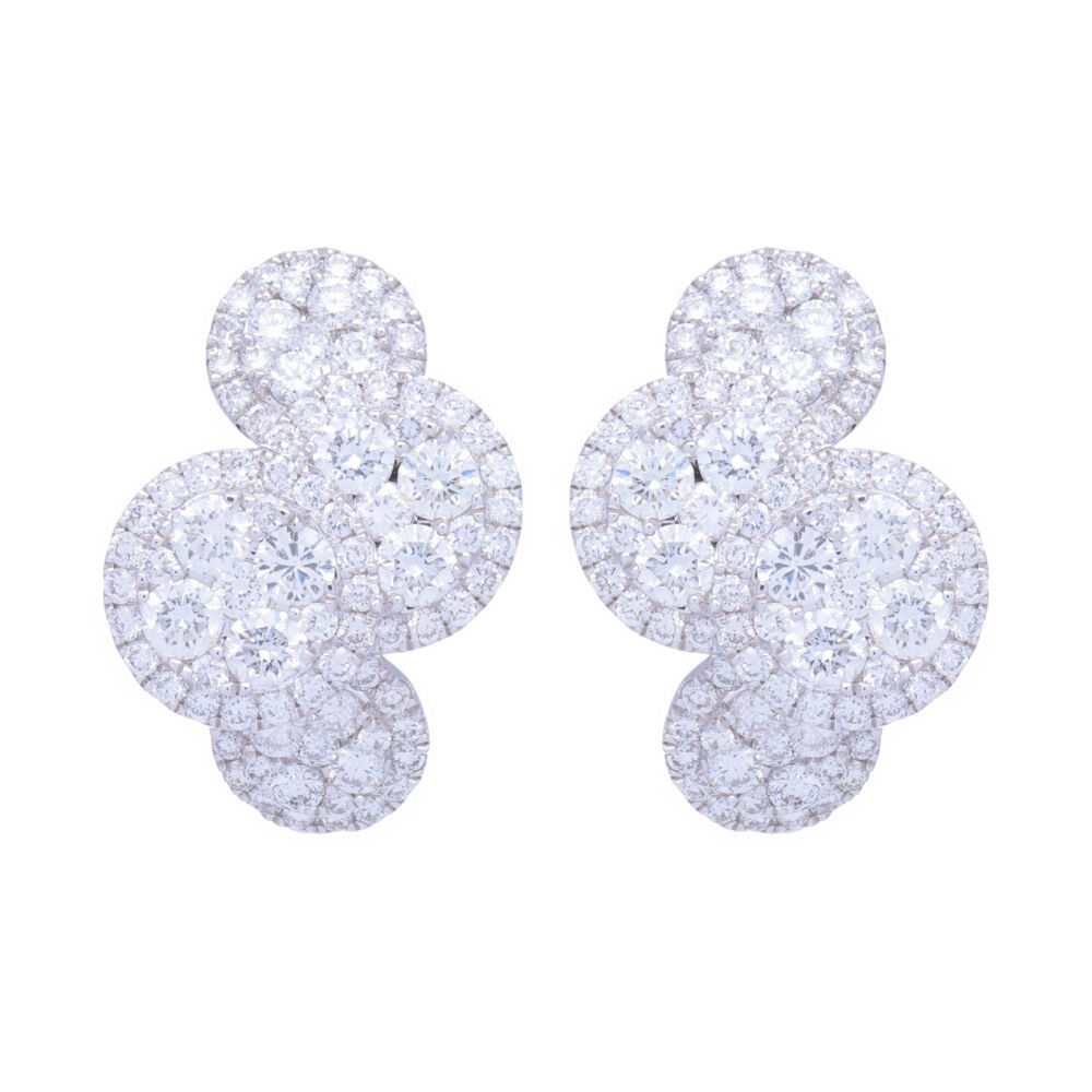 This pair of earrings has 2.3 carats of diamonds set into 18k white gold. These earrings will not get lost in your hair as they can be seen from what seems like space. Stunning white color - and comfortable to wear. Easily turn these into your every day earrings because you'll forget you have them on. 18k White Gold and Diamond Clustered Circle Huggie Hoop Earrings