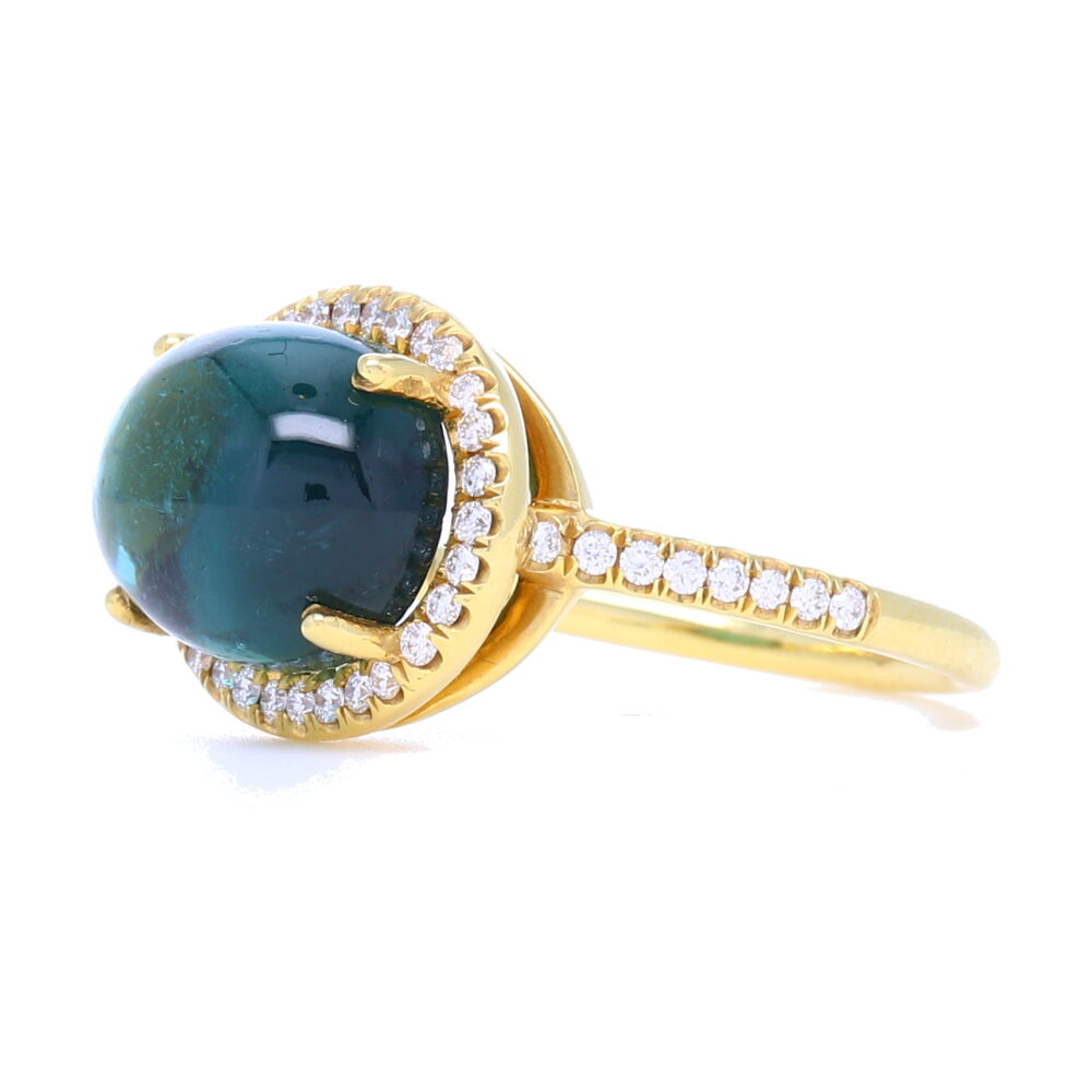 Every piece of the Lauren K Collection is proudly crafted in New York City. The Lauren K Collection is comprised entirely of handpicked gemstones, crafted in 18 karat gold, and finished with delicate micro pave. Each stone is carefully selected for a variety of reasons. In fact, very few are ever chosen for their unspoiled beauty. Instead, most stand out for their characters and flaws which give the finished piece its own distinctive personality and unique look. Our gemstones are always the “star of the show”. Nothing in the collection is mass produced, creating pieces that speak to each individual buyer. Each stone is one of a kind, the finished product may vary to the stock photo as shown.
18k Yellow Gold, Tourmaline, Diamonds 0.31 TCW 18K Tourmaline Cabochon Ring with Diamond Halo