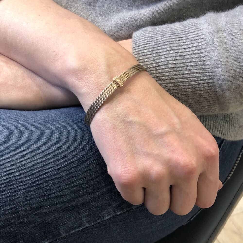This heat treated carnation color cable features an 18k rose gold setting displaying a total diamond weight of 0.05cts. This lightweight bracelet is perfect to stack high, or to wear alone. Carnation Four Strand Bracelet