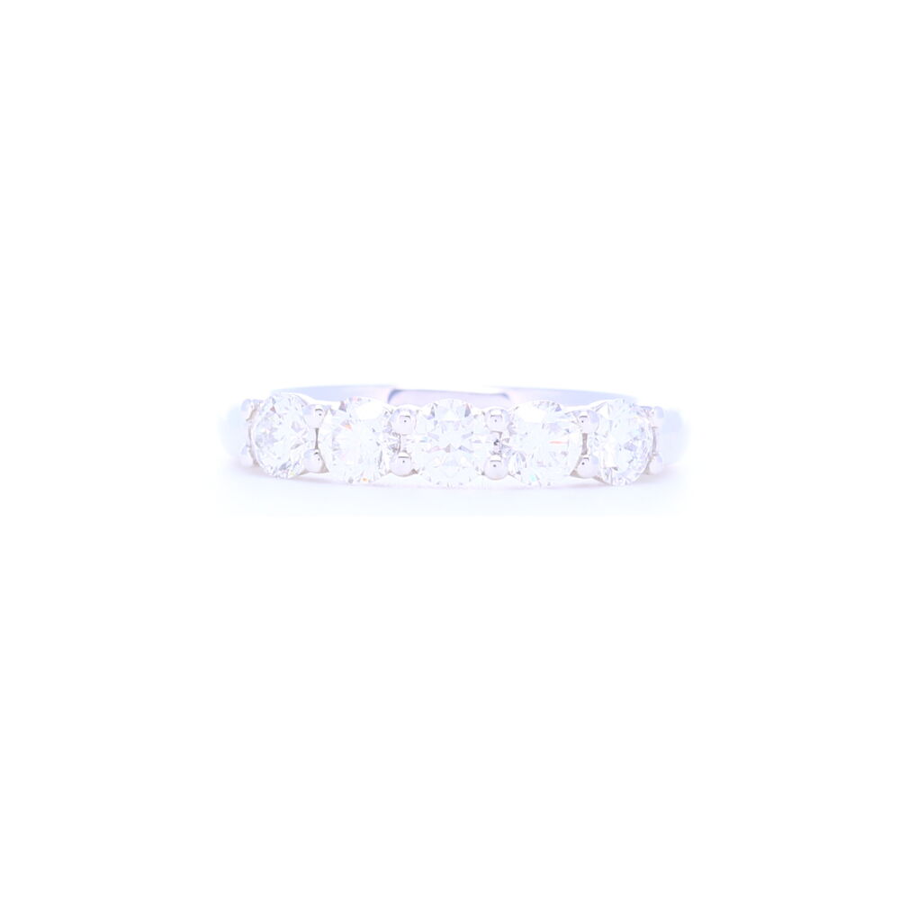Sometimes less is more, and that's our thoughts on this ring. Less diamonds but bigger in size, this ring has 1.07 carats of diamonds set into 4.09g of 18k white gold. The diamonds are beautiful, full of sparkle and bright white. Doesn't go 1/2 way around but what it gains in less stones is more bling in size and more comfort to wear. 18k White Gold 5 Stone Brilliant Cut Diamond Stack Ring