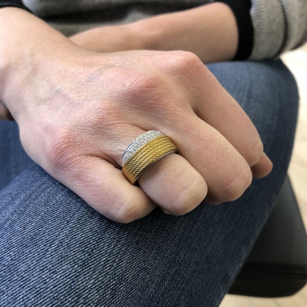 This six strand yellow colored heat treated steel cable ring from ALOR, features an 18k white gold 1/2 band peeking out of the steel cable. Displaying a total diamond carat weight of .36 carats, making this ring simply elegant for any occasion. Peekaboo Yellow Ring