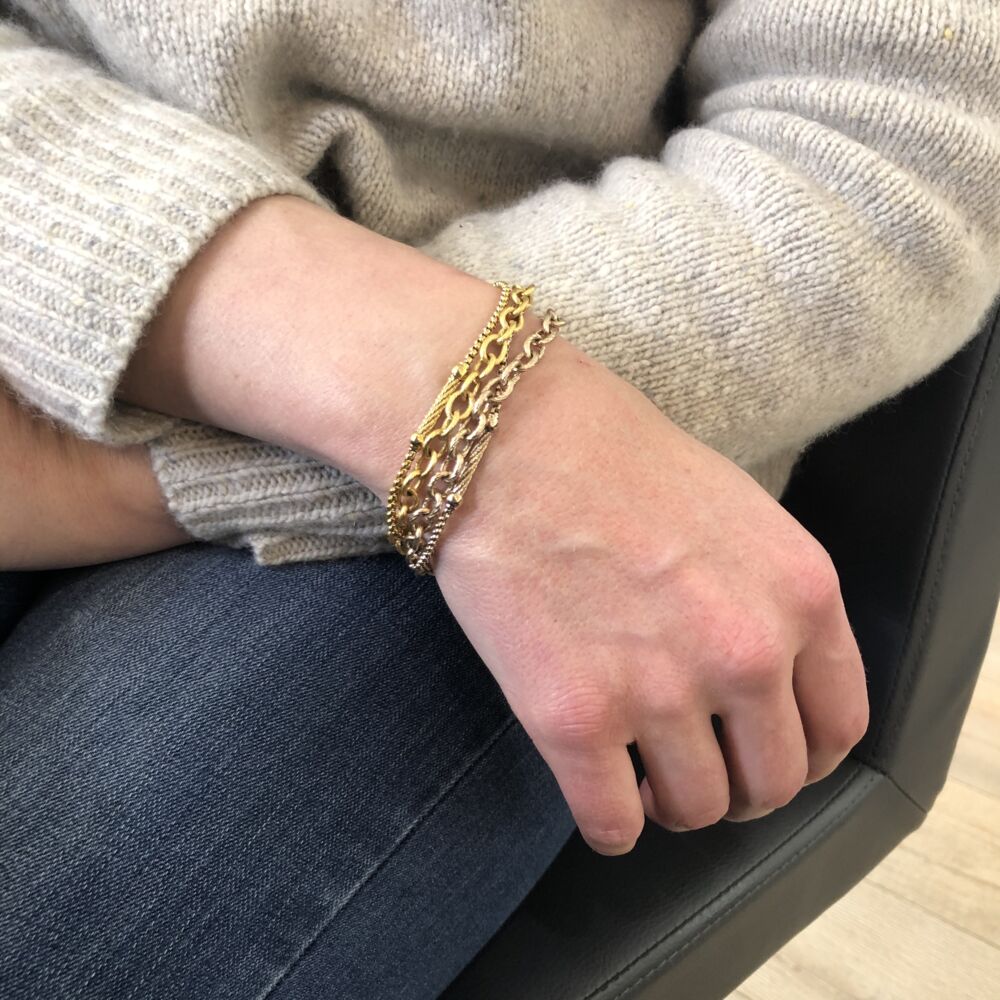 <div>This two tone bracelet features two different colors. Also featuring two mixed metals; one large linked chain, and one very small linked chain with bar stations along its link. One of the large and the small links are displayed in yellow color, while the other two are displayed in carnation color. Alternating in color and metal, the links are all connected at each end of the bracelet, letting it dance around on your wrist. Perfect to stack with others, or to wear alone. </div> Chain Reaction Two Tone Link Bracelet