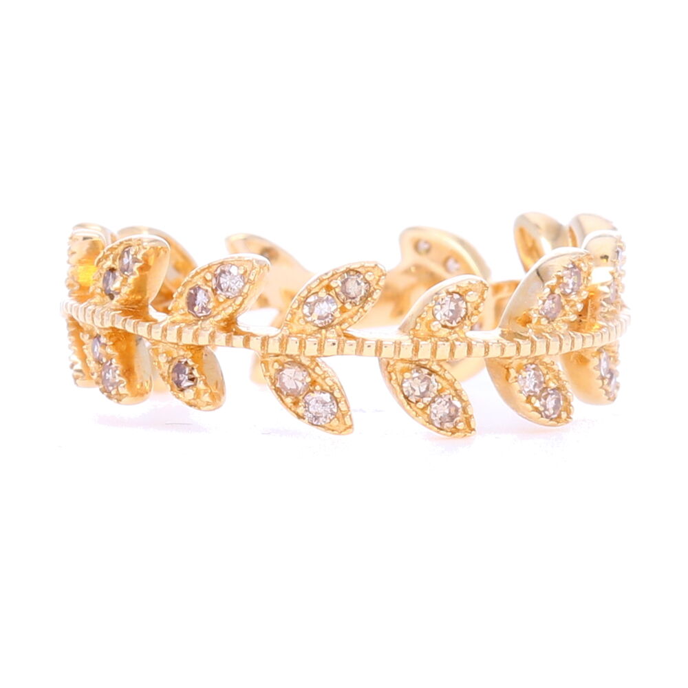 One of our best sellers, this ring gives you just enough width, negative space, and sparkle for a killer price to be the shining star of your stack. Pairs with nearly every other ring and comes in all 3 colors, this will be your favorite. Meant to mimic an actual vine, it's whimsical and stylish. Order a 1/2 size up for this if you want to pair it with others. Wider rings when stacked together will be more comfortable if ordered slightly larger. 14k Gold Vine Eternity Band/Stack Ring