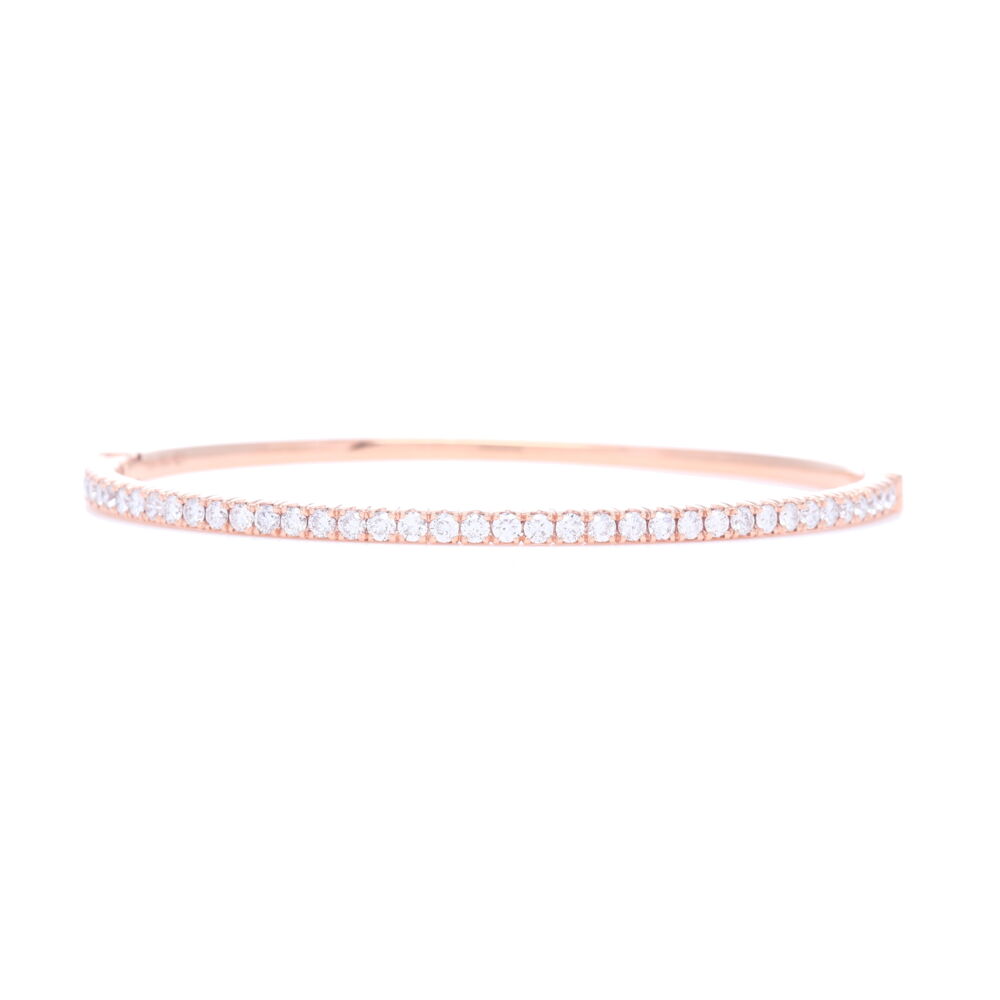 1.32 carats of prong set diamonds are set into 18k Rose Gold in this hinged oval shaped bangle bracelet. 18k Rose Gold Prong Set Diamond Hinged Bangle Bracelet