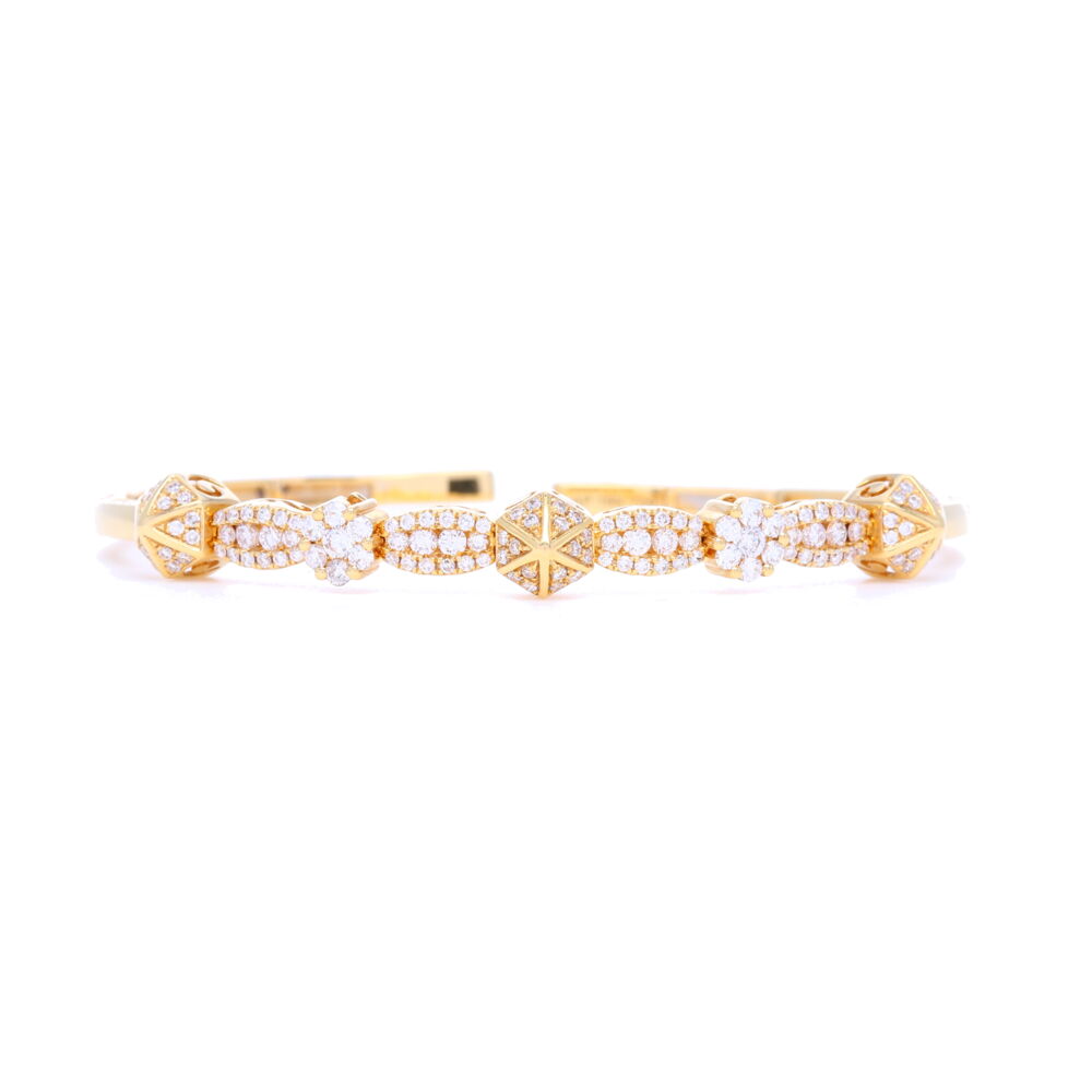 Fantastic cuff bracelet which fits a bit on the smaller size. A small 6 would easily fit this bracelet. 1.04 carats of diamonds set into 18k yellow gold. This bracelet is easy to get on and off, fits securely when on and is extremely comfortable. Great for stacking, plays well with others... 18k Diamond Pyramid Flexible Bracelet