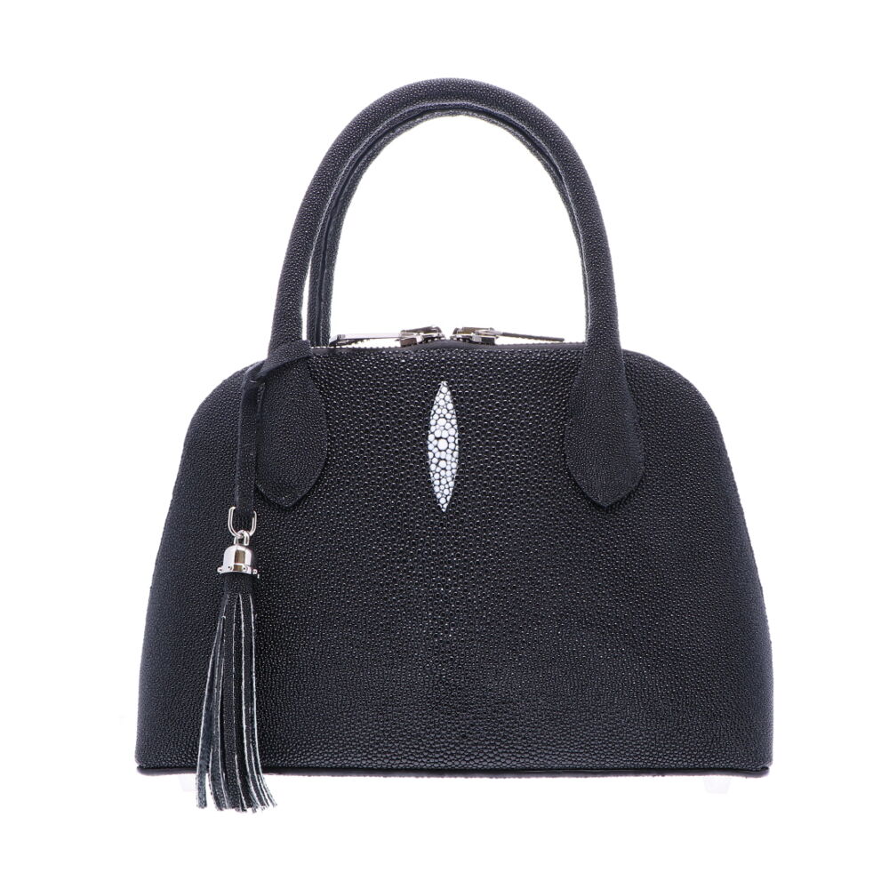 LaNae’s Small Dome is a top handle bag made of genuine stingray skin. Proudly handcrafted in the USA by 3rd generation artisans, all edges are hand painted, interior is garment suede and is detailed with Italian palladium hardware. This classic style comes with a fun tassel that can be detached. The interior has a zippered and a cell phone pocket. Under the handles are D rings to attach the over the shoulder strap (up to 25”). Each luxury bag is one of a kind and especially made for you to stand out against the crowd! Black Stingray in Small Dome