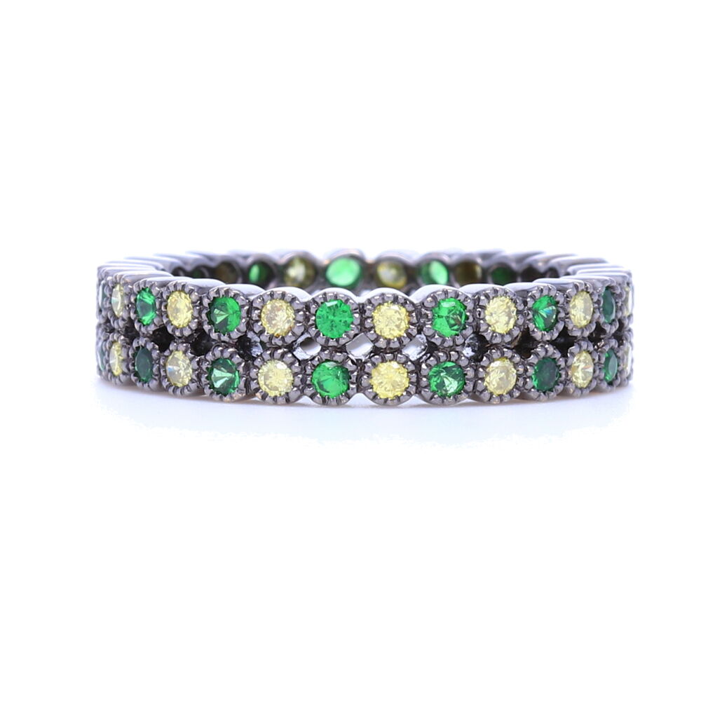 This burst of green, black and white, tsavorite and diamond bezel set double row stack ring is perfect for adding edge to any stack. Substantial enough to wear on it's own or pair with white gold for a super striking contrast. Set in 18k gold with black rhodium finish, this edgy black ring is brightened up by the green tsavorite. Diamond weight is .52 carats and over 5.5 grams of 18k gold, this ring feels luxurious. Double Row Tsavorite and Round Diamond Bezel Set Stack Ring in 18K Gold with Black Rhodium