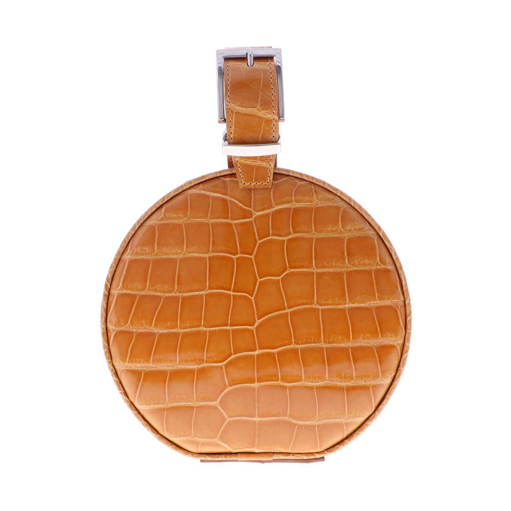 LaNae's Hat Box Chain Bag has been crafted out of genuine American Alligator with a premium High Gloss Caramel finish. Due to the premium quality of each high gloss skin our 3rd generation artisans are required to hand stitch each bag. As always our hardware is the finest Italian Palladium and each interior has been lined with a Garment Quality Suede which keeps each bag light yet durable. Proudly crafted in the United States. Caramel Alligator Hat Box Chain Bag