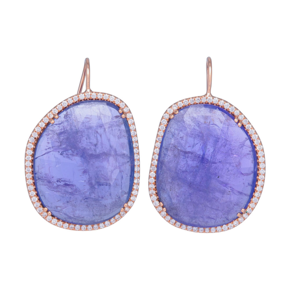 Want a one-of-a-kind look, love Tanzanite, need new? These are it! Stunning Tanzanite is the star of these earrings, thoughtfully set in 18k Rose gold for a truly unique take on your typical tanzanite jewelry. Lauren K has all of her jewelry handcrafted in NYC. Halo Set Rough Tanzanite Earrings in 18k Rose Gold