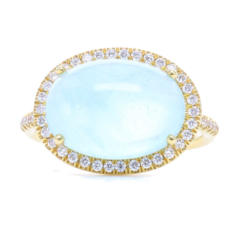 Love cabochon, love aqua - so does Lauren K! Leave it to her to give a fresh take on a classic style, a halo has never looked so good next to a beautiful cabochon. Feels like summer just looking at this ring but this aqua can be worn every day. Slim side profile, it makes this so comfortable, you'll forget you're wearing it. No two stones are exactly alike. Can't decide online, try it on in store! 18k Yellow Gold, Diamond Halo Cabochon Aquamarine Ring