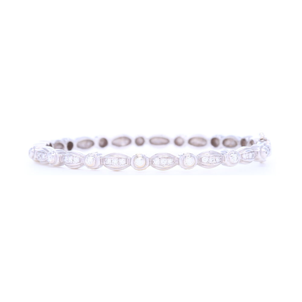 This Doris Panos 18k white gold bracelet has .35 carats of round diamonds. This unique and classic bracelet is versatile enough to be worn alone or with other bangles. This bracelet is the perfect addition to any jewelry lovers collection. Doris Panos 18k White Gold Diamond Bangle