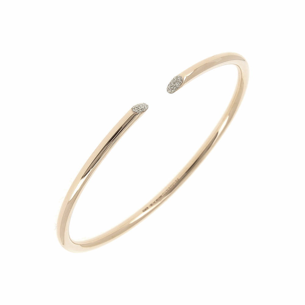 The Thin Diamanti Bangle Bracelet by Pesavento is truly a stunner. This 18k rose gold and champagne diamond dusted cuff is simple, yet elegant and has the versatility to be worn a number of ways. Whether worn on its own or mixed with other bangles, this is a staple item for every jewelry lovers collection. Thin Diamanti Bangle Bracelet
