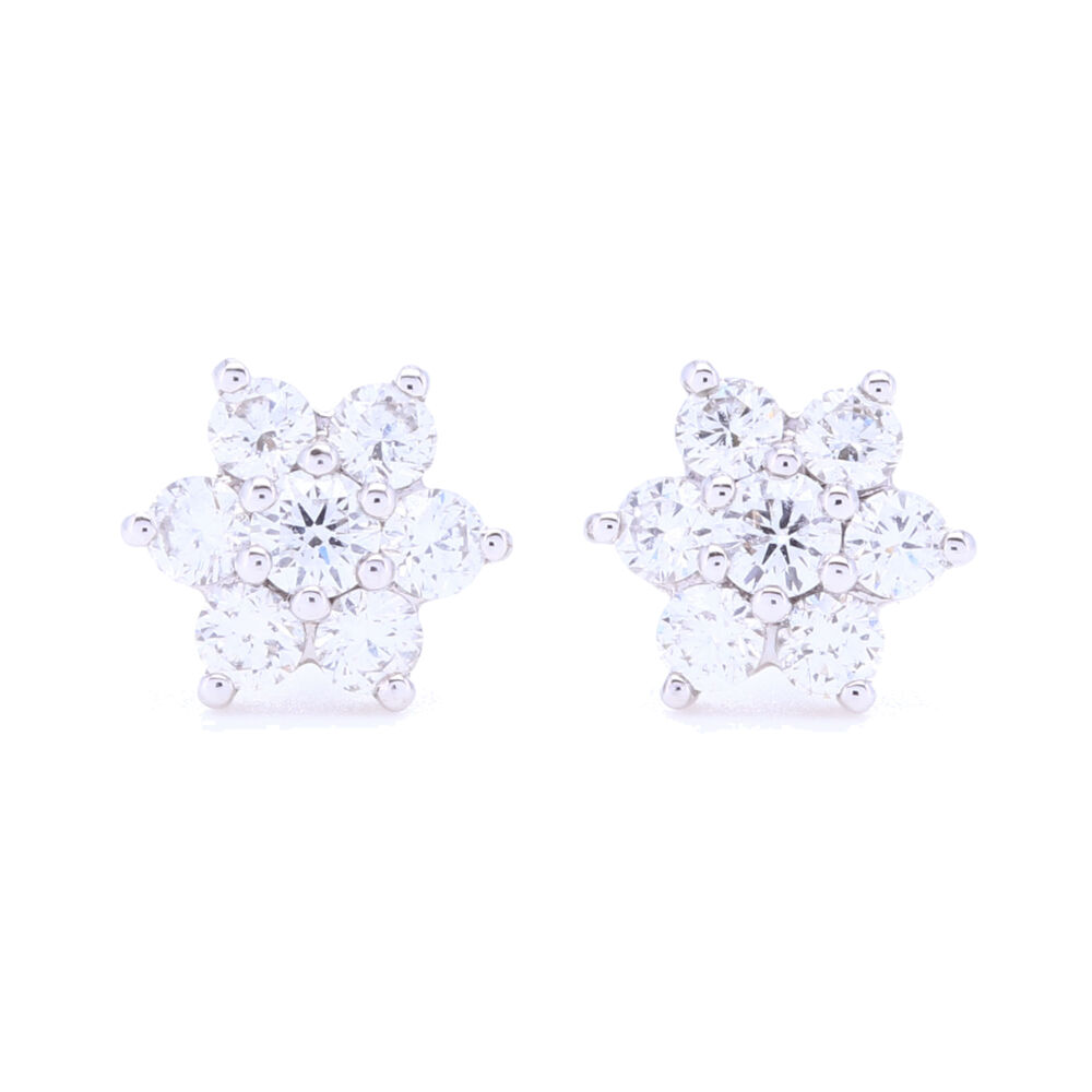 Classic cluster star design set in 18k white gold with brilliant cut white diamonds. These are petite yet will shine bright, easily worn in a first or second piercing. .47 total carat weight 18k White Gold Small Diamond Cluster Studs